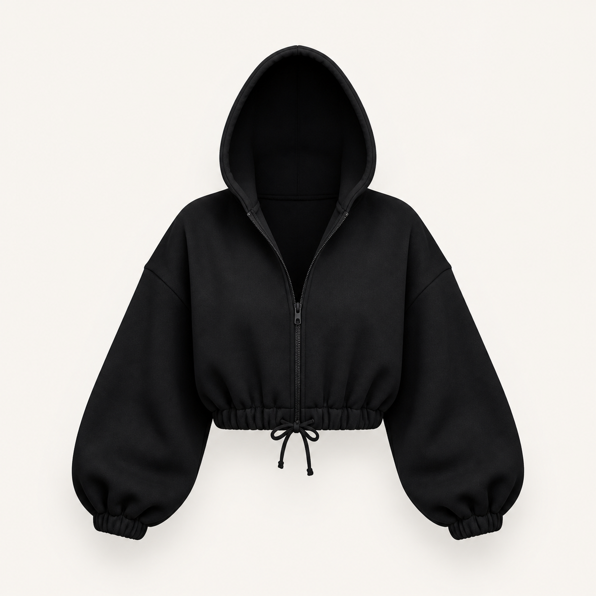 ブラックのクロップド ジップアップフーディ。無人の商品正面画像。